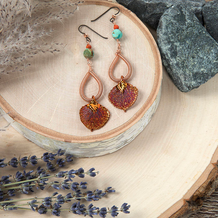 Model wearing copper aspen leaf and turquoise earrings by Buckaroo Bling