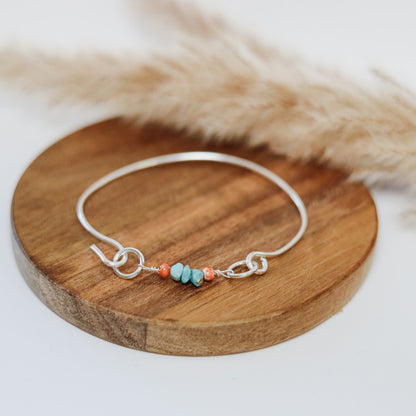 Silver bangle with turquoise and spiny oyster