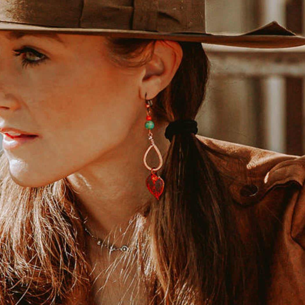 Model wearing aspen leaf earrings in copper