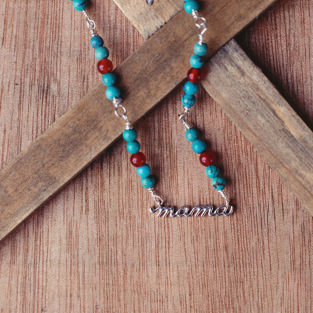 Turquoise necklace with silver mama pendant