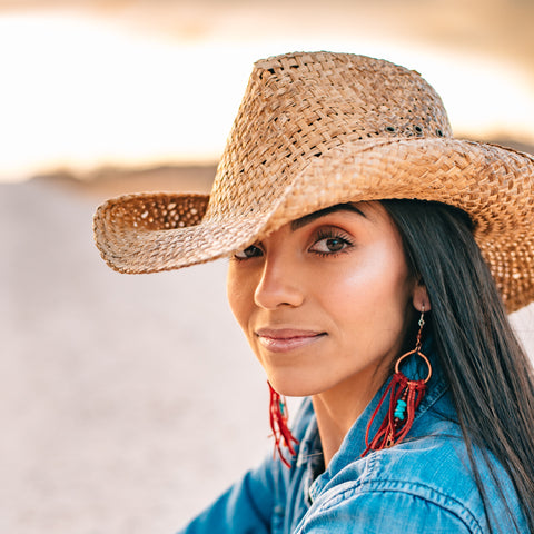 Model Karina Perez modeling earrings by Buckaroo Bling